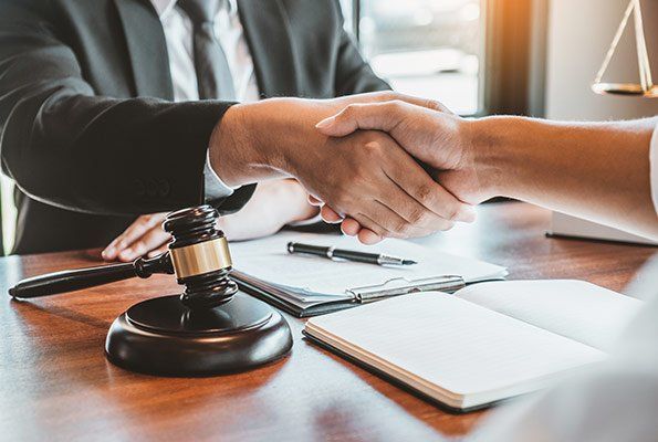 Shaking Hands With An Attorney — St. Minneapolis, MN — Absolute Bail Bonds