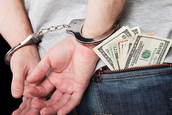 Cash Inside Man's Pocket — St. Minneapolis, MN — Absolute Bail Bonds