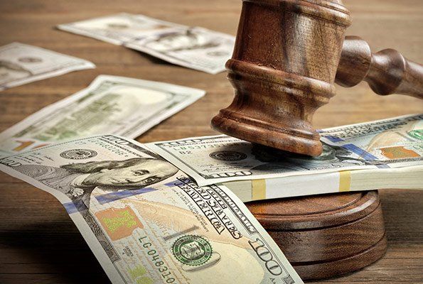 Cash Scattered With Gavel — St. Minneapolis, MN — Absolute Bail Bonds