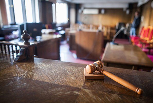Gavel Inside An Empty Courtroom — St. Minneapolis, MN — Absolute Bail Bonds