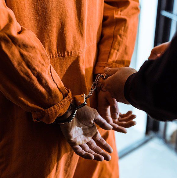 Prisoner Wearing Handcuffs — St. Minneapolis, MN — Absolute Bail Bonds