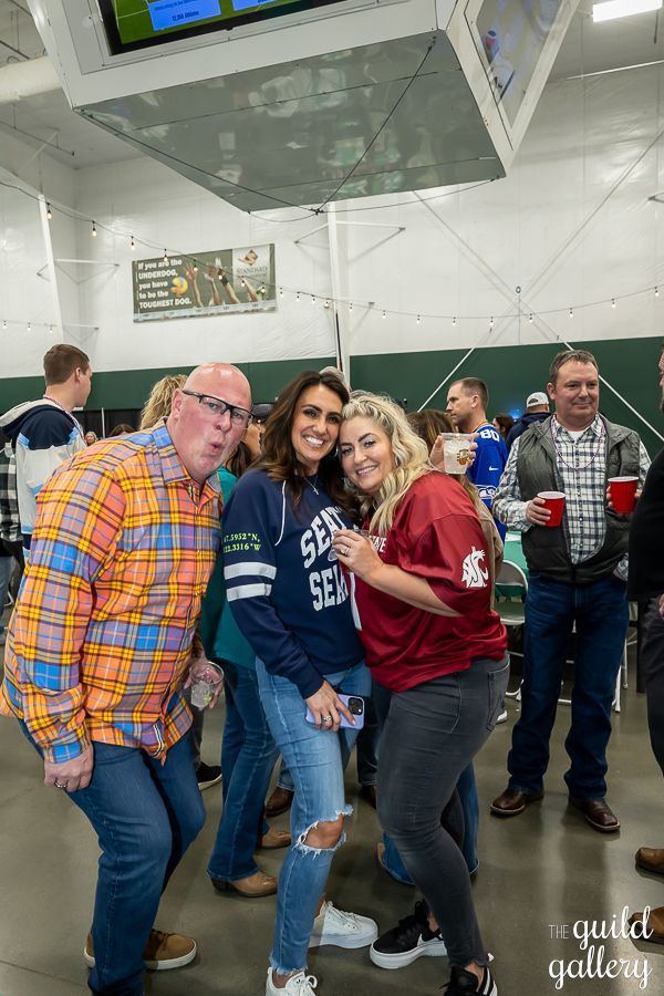 A group of people are posing for a picture in a room.