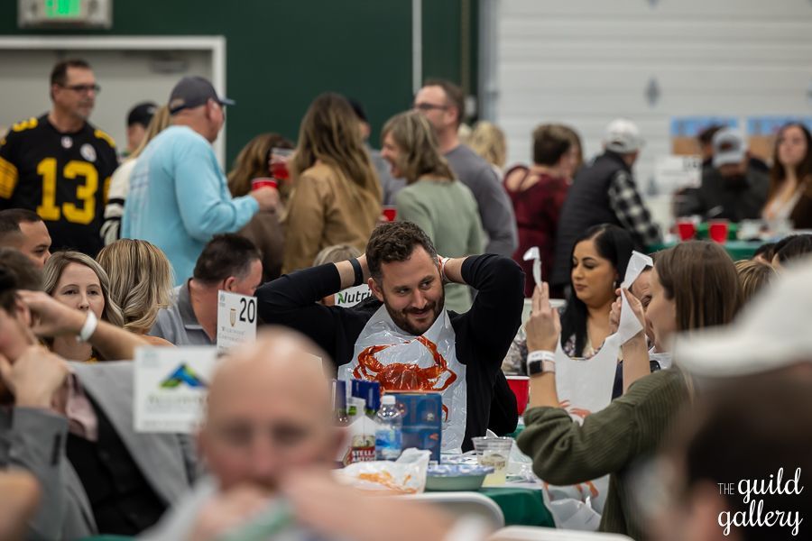 A group of people are sitting at tables in a room.