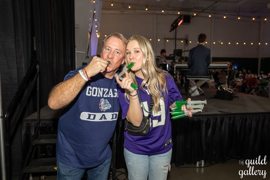 A man and a woman are standing next to each other on a stage.