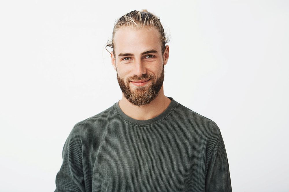 Man With Beard and Long Hair Pulled Back — Bermann Barbershop in Casey, ACT