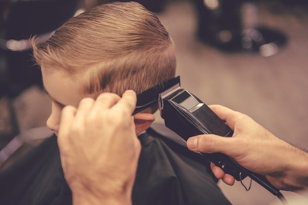 Person Getting a Haircut With Electric Clippers — Bermann Barbershop in Ngunnawal, ACT