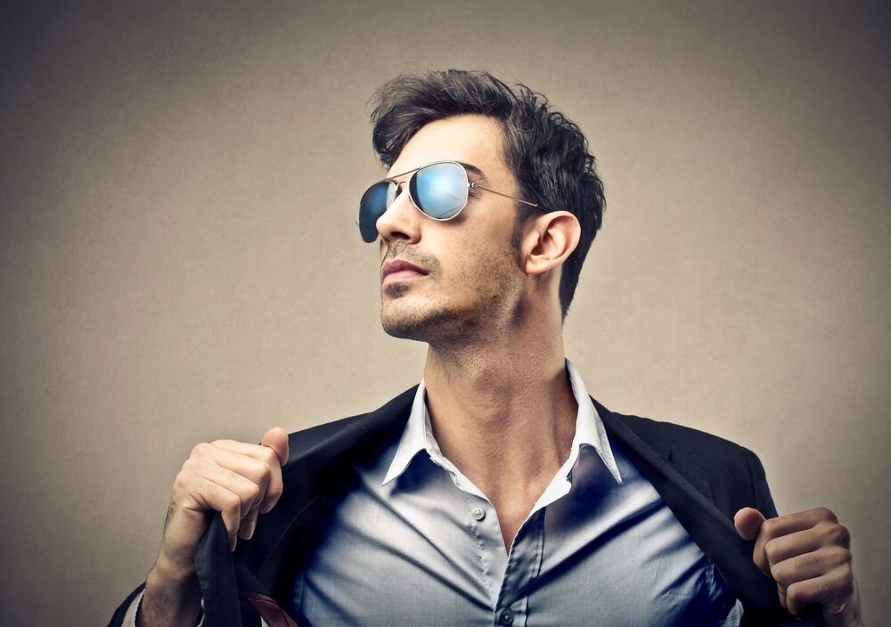 Man in Suit Jacket an — Bermann Barbershop in Casey, ACTd Sunglasses, and Hairstyle