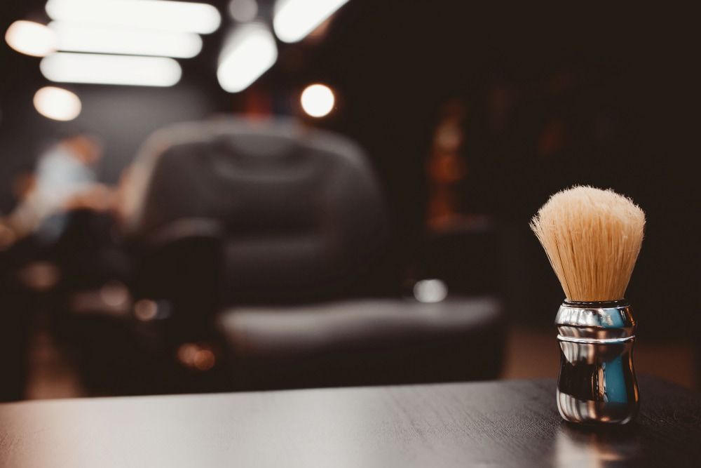 Shaving Brush on a Dark Barbershop Table — Bermann Barbershop in Nicholls, ACT