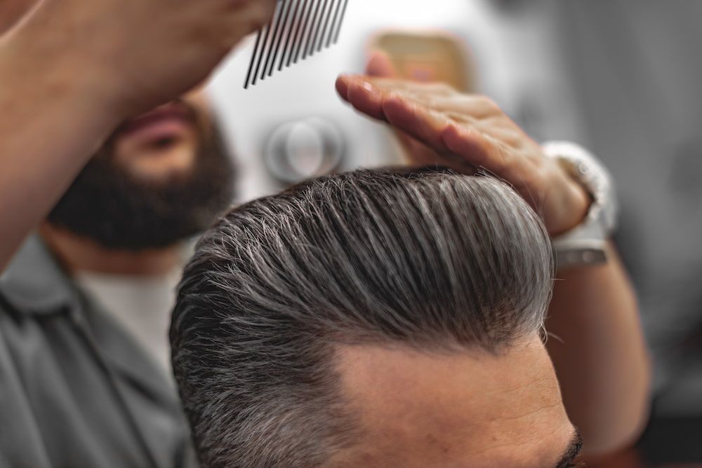 Barber Styling Gray Hair With Comb; Hands Visible — Bermann Barbershop in Ngunnawal, ACT