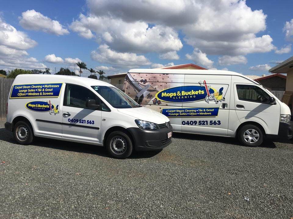 Worker Cleaning Second Storey Window — Cleaning Company in Bundaberg