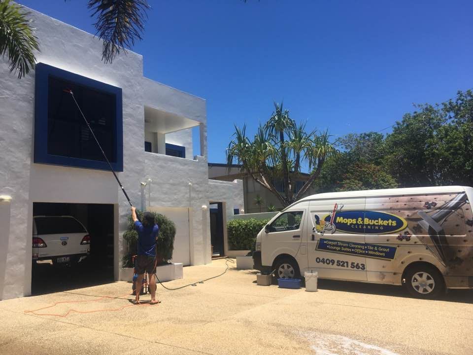 Male Worker Cleaning Residential Carpet — Cleaning Company in Bundaberg