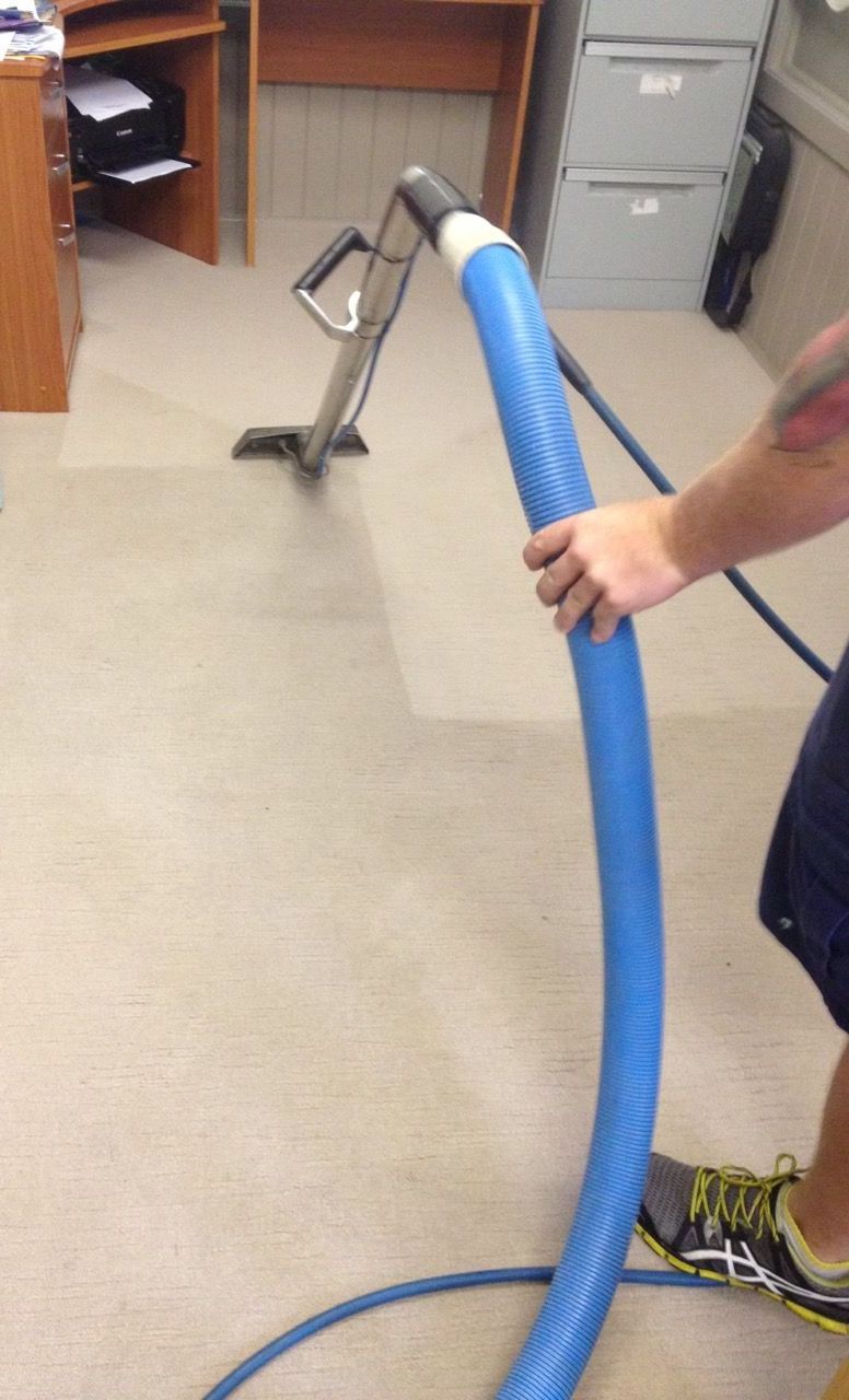 Male Worker Cleaning Office — Cleaning Company in Bundaberg