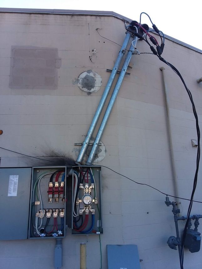 A damaged electrical outlet has the word on it