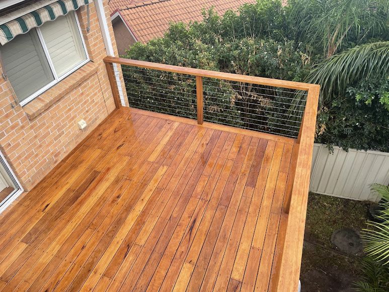 An Aerial View of a Wooden Deck With a Wire Railing — Portstyle Constructions in Nerang, NSW