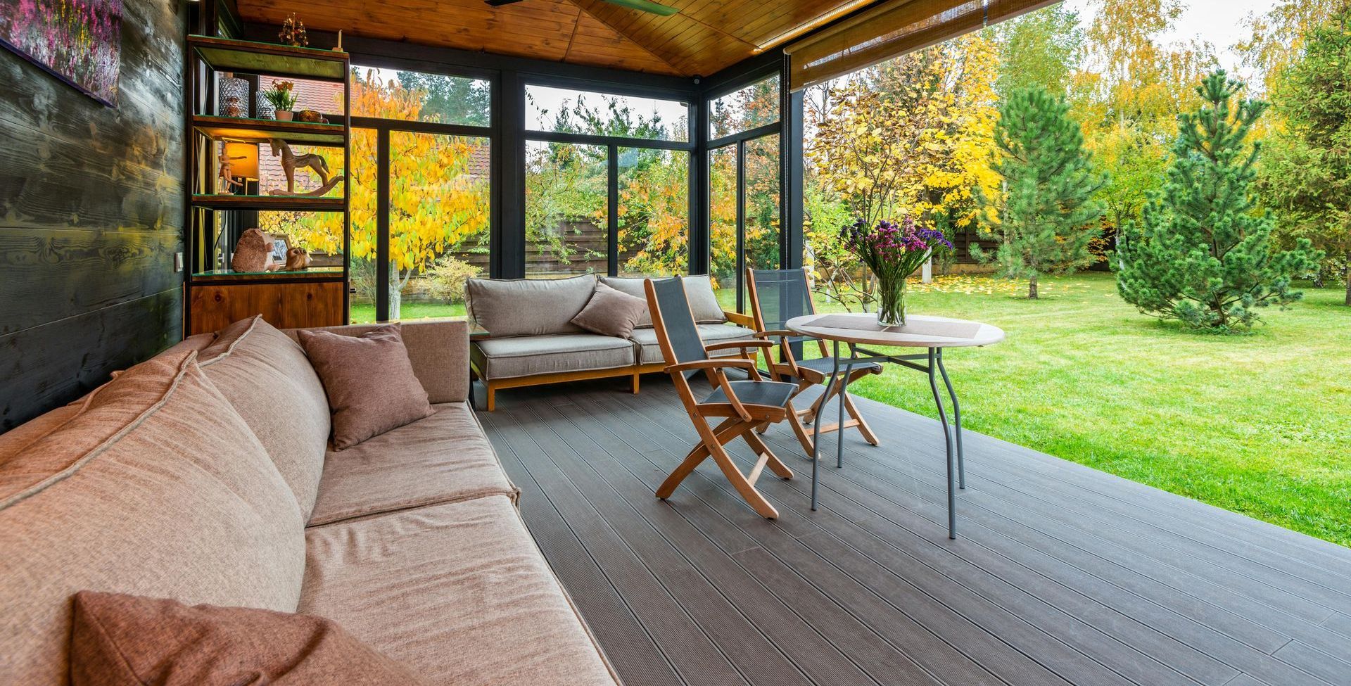 A Patio With a Couch, Table and Chairs Under a Canopy — Portstyle Constructions in Surfers Paradise, QLD