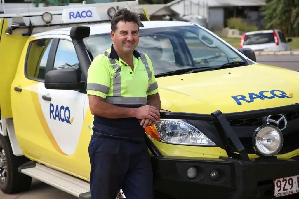 A Man Is Standing In Front Of A Racq Truck — Cam Duffy Autos In Atherton, QLD