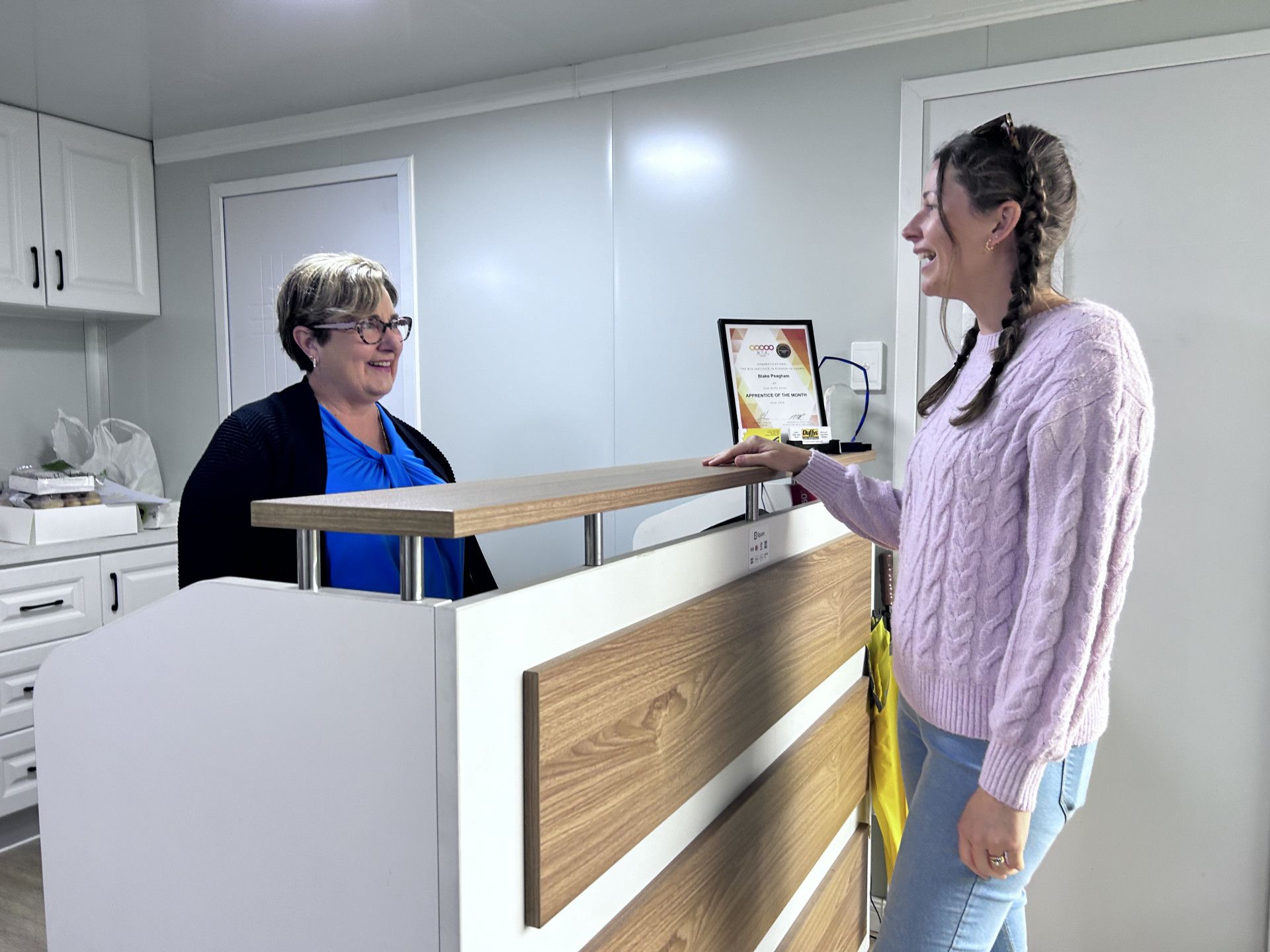 Women talking in mechanic shop — Cam Duffy Autos In Atherton, QLD