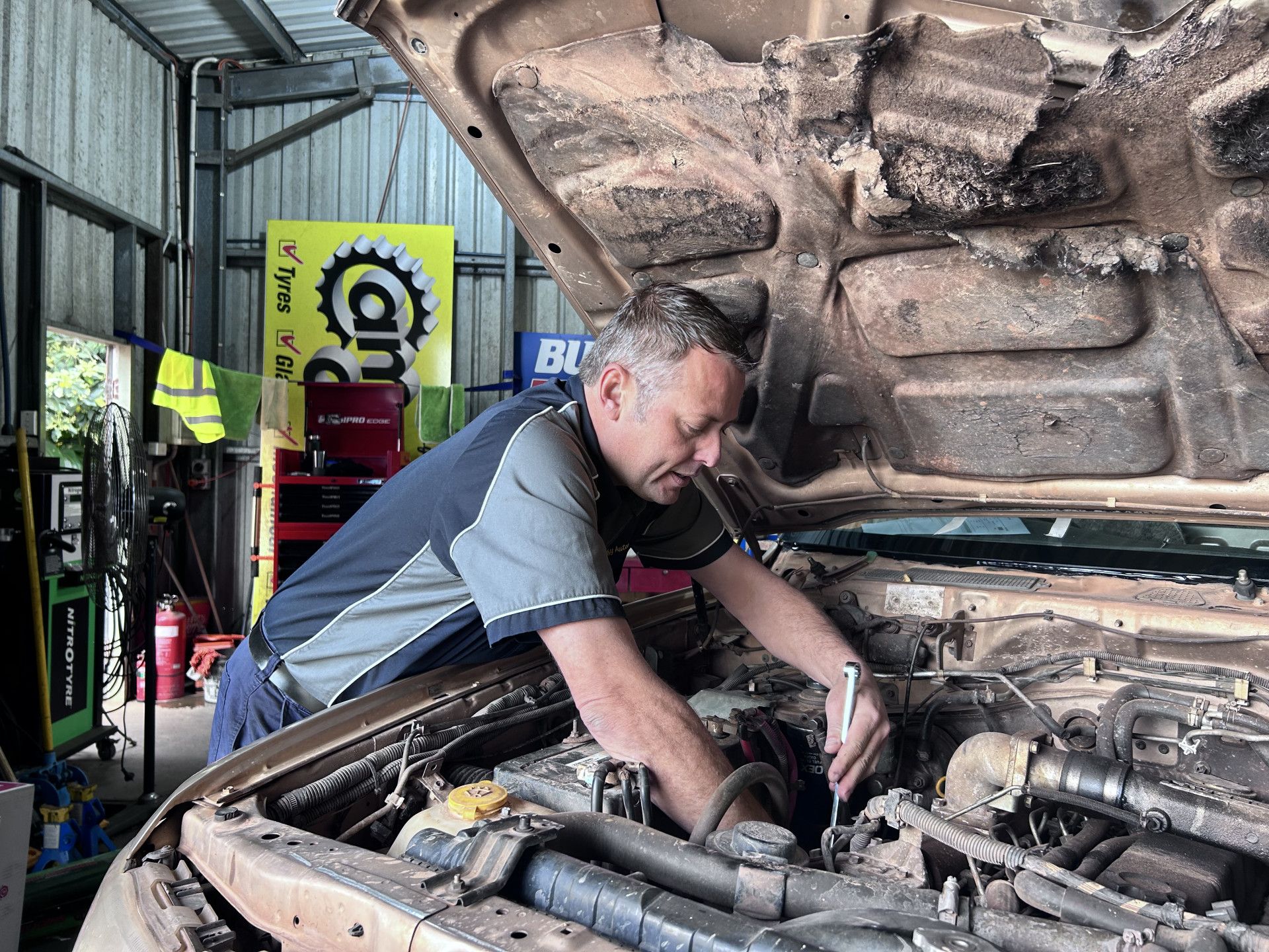 Mechanic fixing engine — Cam Duffy Autos In Atherton, QLD