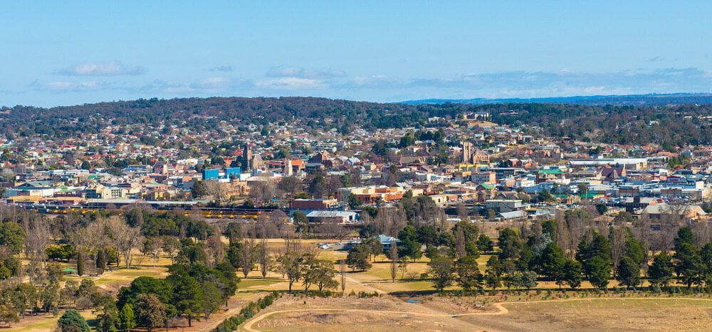 An Aerial View Of A City Surrounded By Trees And A Field — Cam Duffy Autos In Tablelands, QLD
