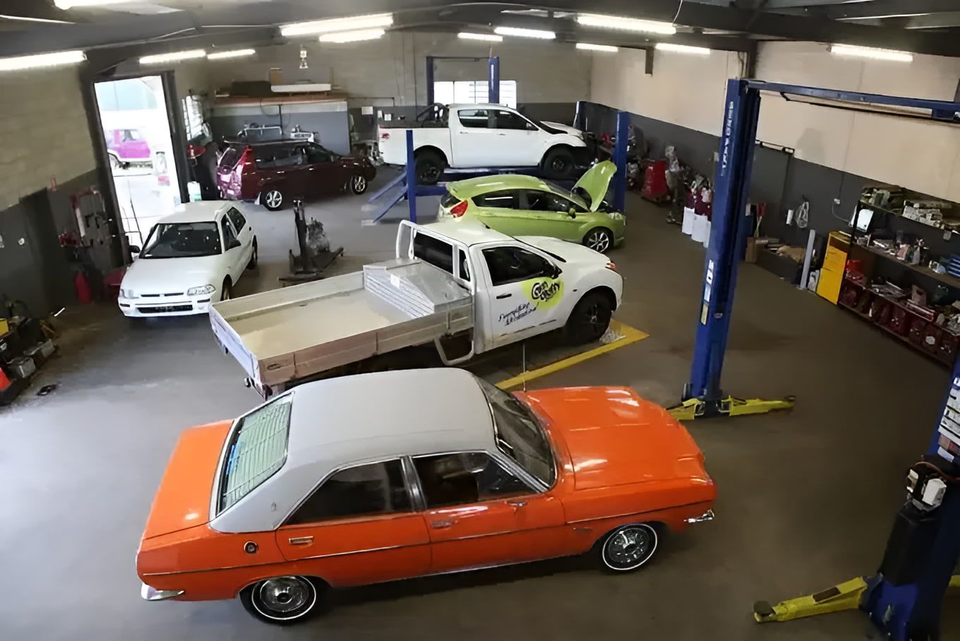 A Bunch Of Cars Are Parked In A Garage — Cam Duffy Autos In Atherton, QLD