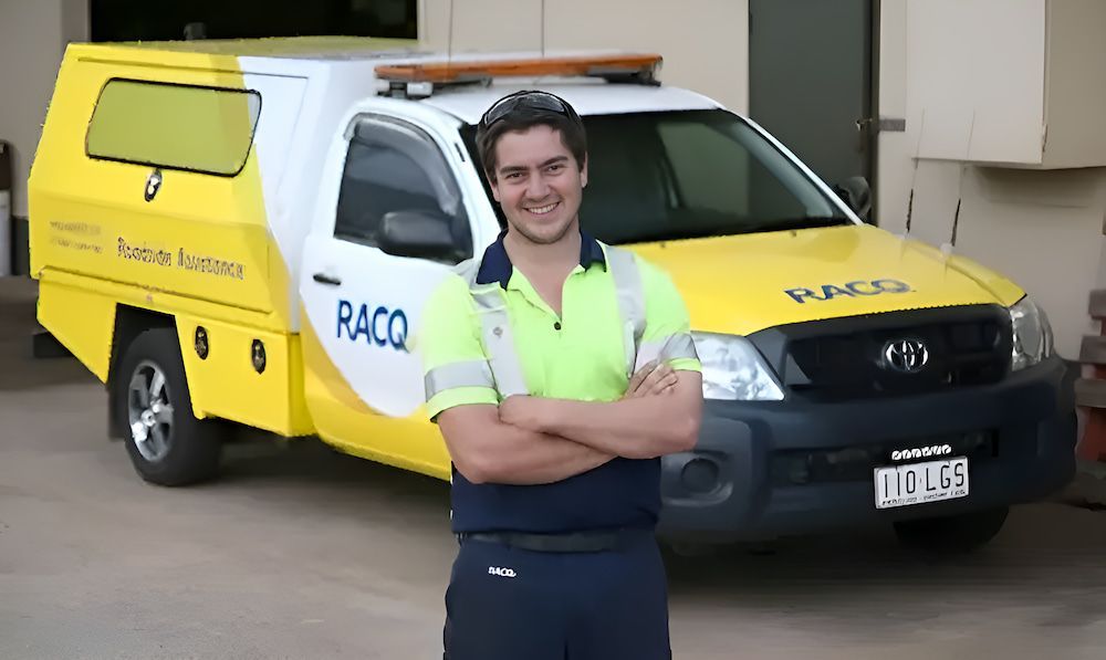 A man Is Standing In Front Of A Car— Cam Duffy Autos In Tablelands, QLD