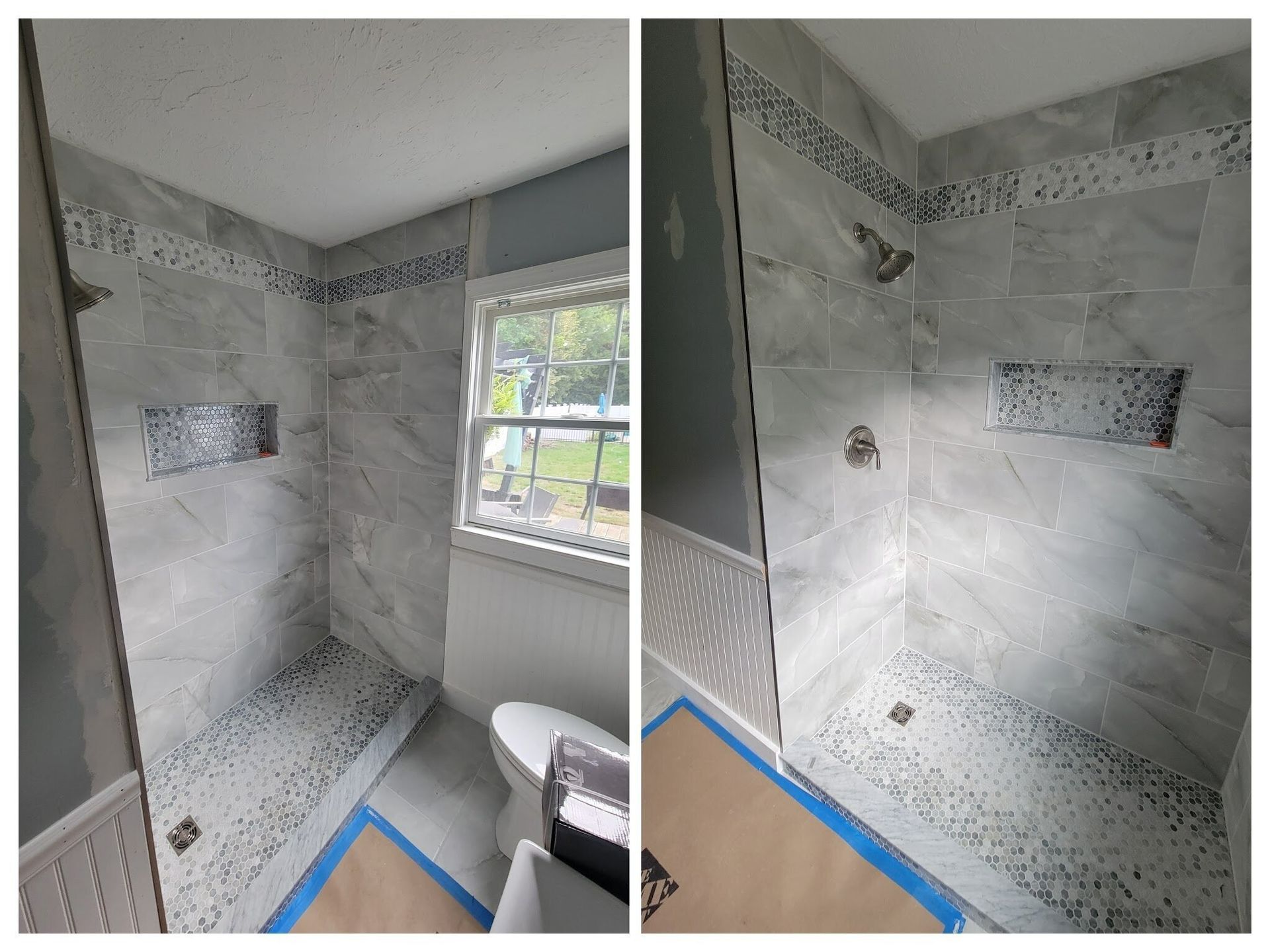 Bathroom with tiled shower and pebble floor, blue and gray tones.