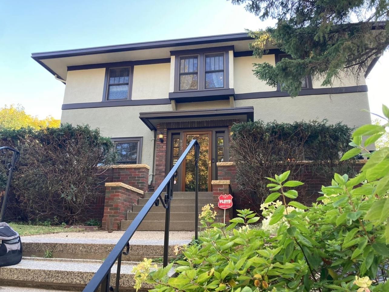 A house with stairs leading up to the front door