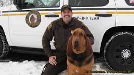 DOG WITH A POLICEMAN