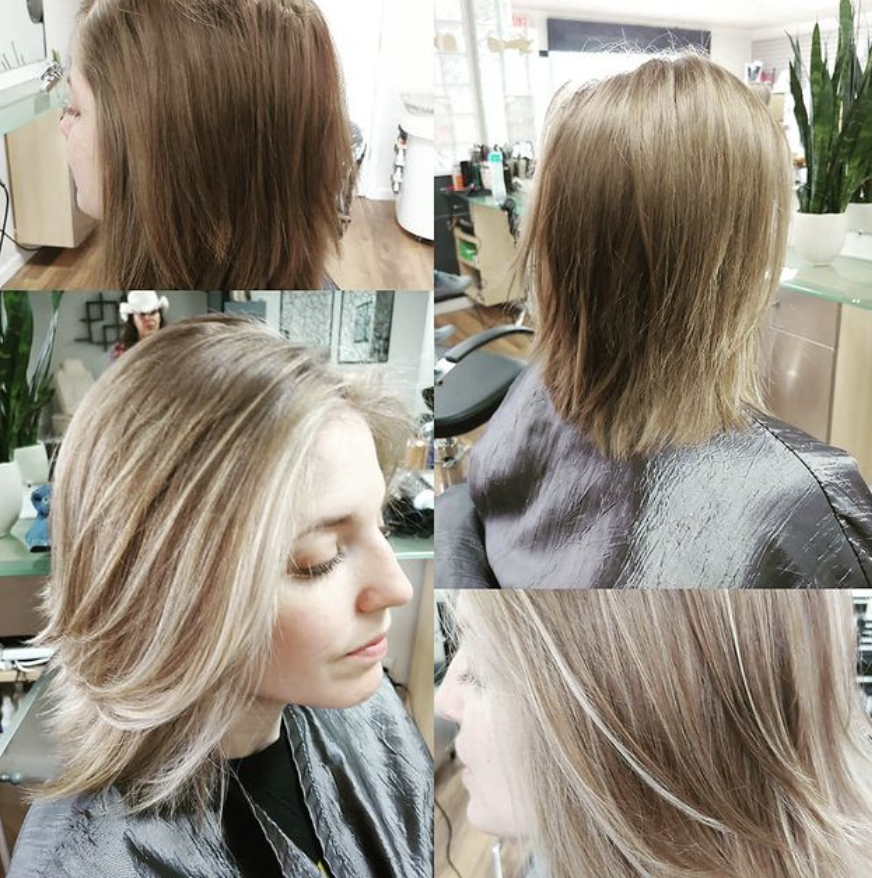A woman is getting her hair done in a salon