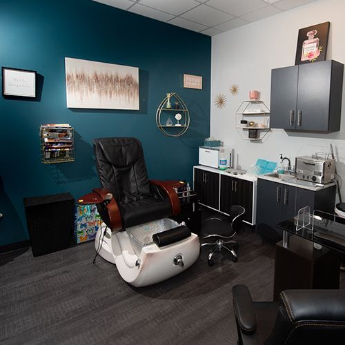 A room with a chair and a sink in it