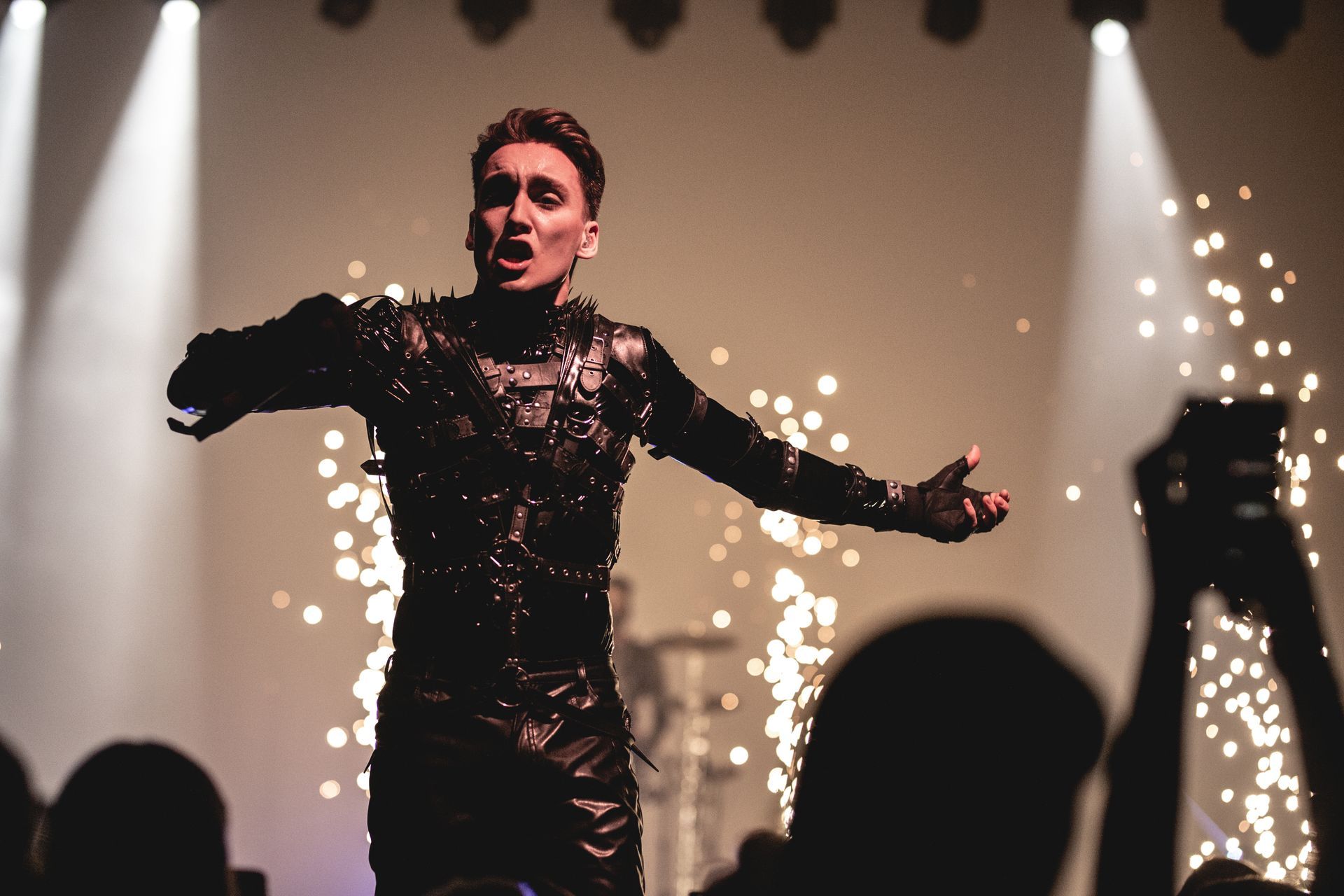 Hatari performs at Stapi, in Hljómahöll in dark leather armor with sparks flying on stage.