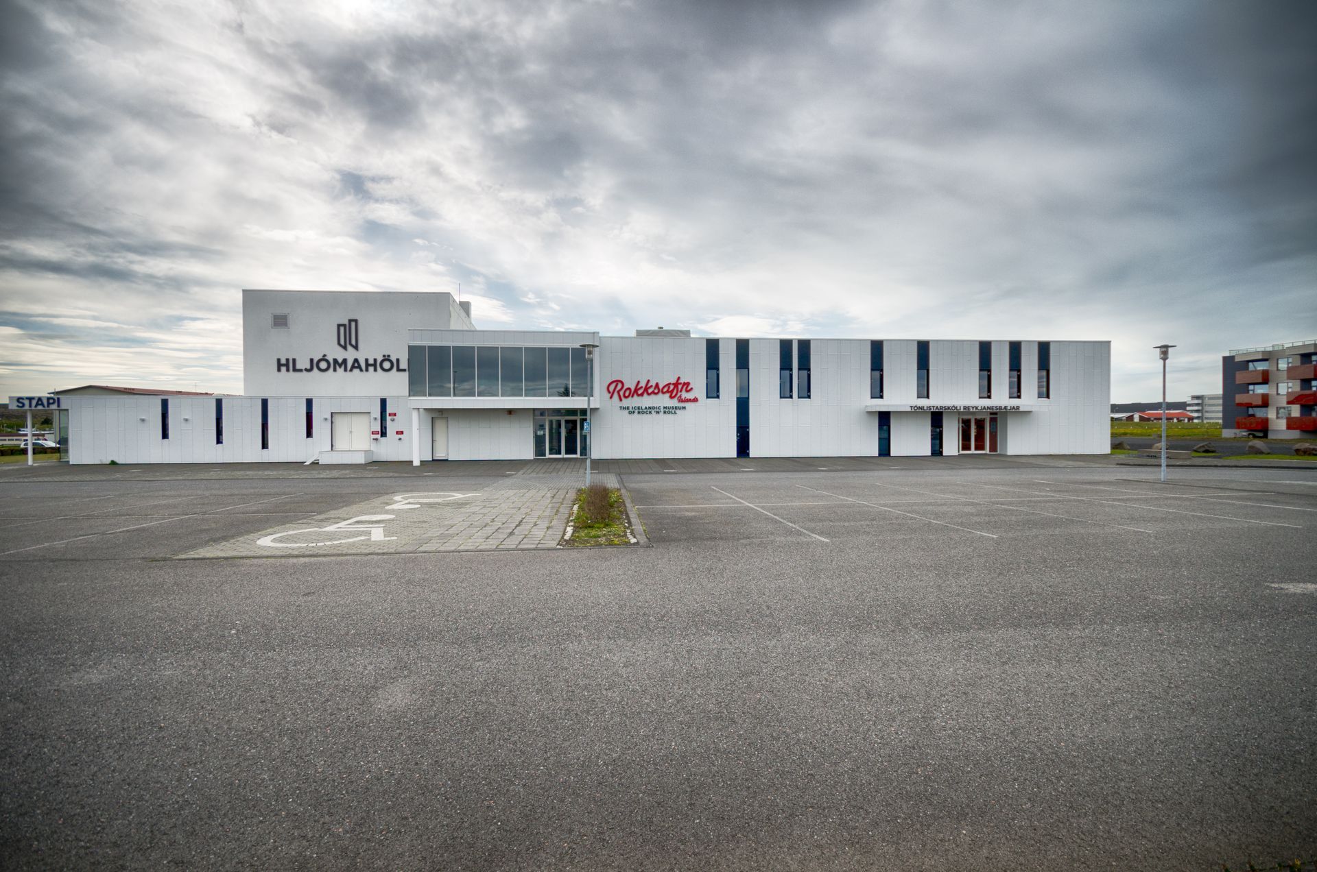 Hljómahöll and Rokksafn Íslands exterior in Reykjanesbær, wide front view of the venue and museum.