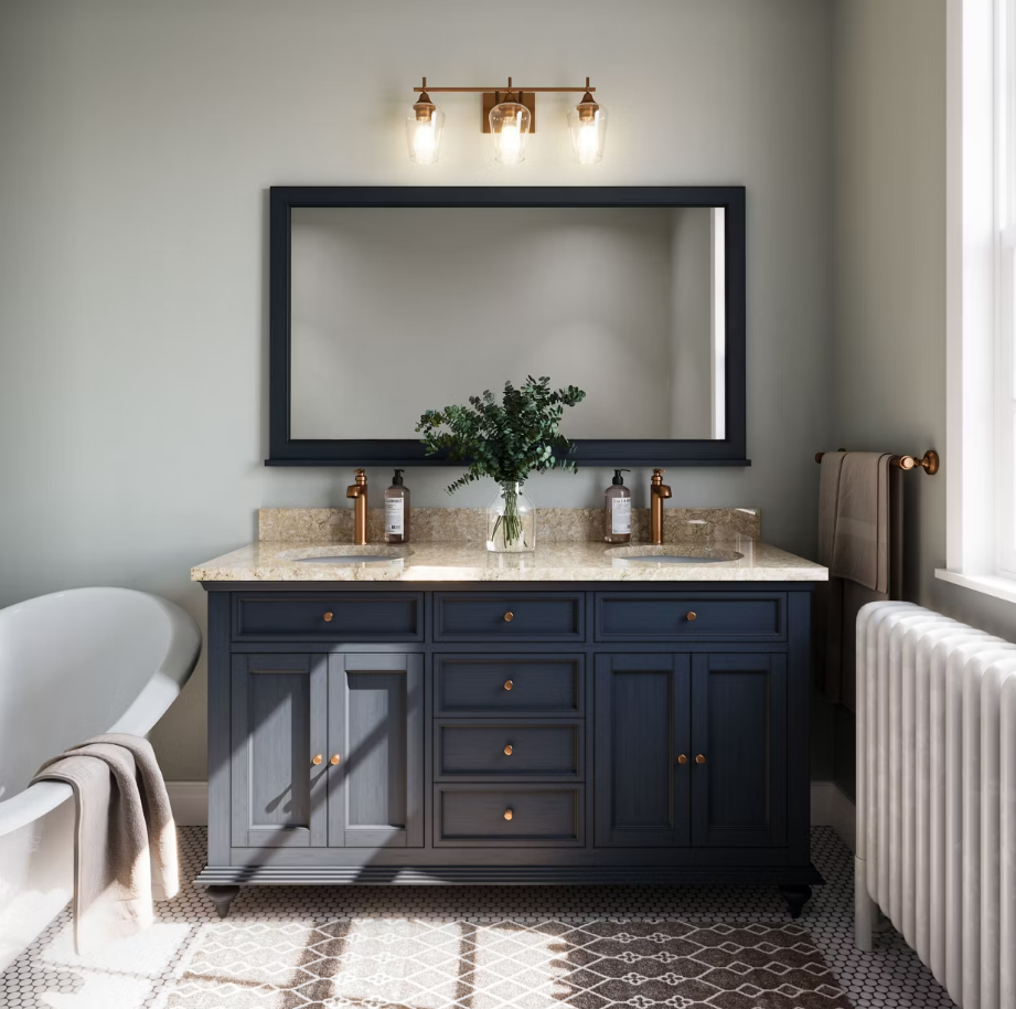 Bathroom with navy vanity, tan countertop, large mirror, and copper light fixture.