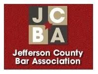 Logo of Jefferson County Bar Association, red background, JCBA letters in blocks, white text.
