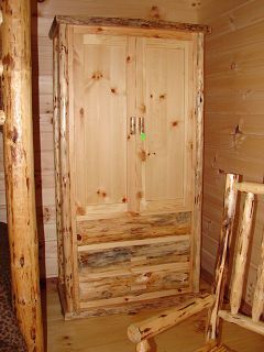 A wooden wardrobe with drawers and a chair in a cabin.