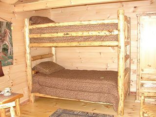 There is a bunk bed in the middle of the room.