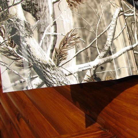A wooden table with a picture of trees on it