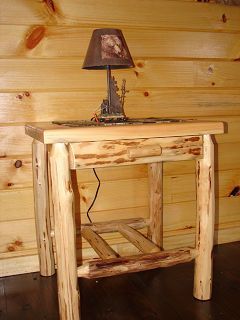 A wooden table with a lamp on top of it