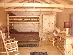 A bedroom with a bunk bed and rocking chairs