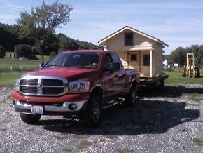 A red truck with a new york license plate