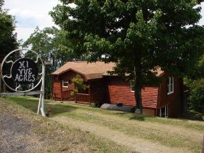 A house with a sign that says 301 yve acres