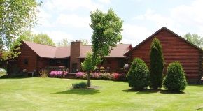 A large house with a large lawn in front of it