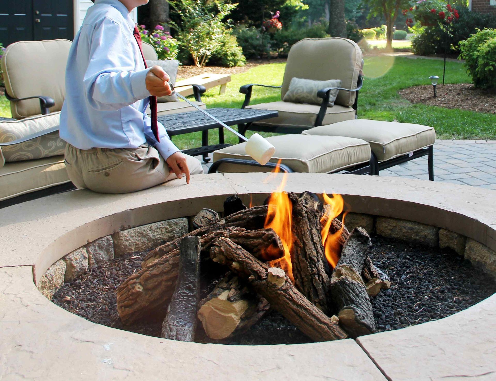 Roasting Marshmallows Over an Affordable Backyard Fire Pit Made from Brick and Stone