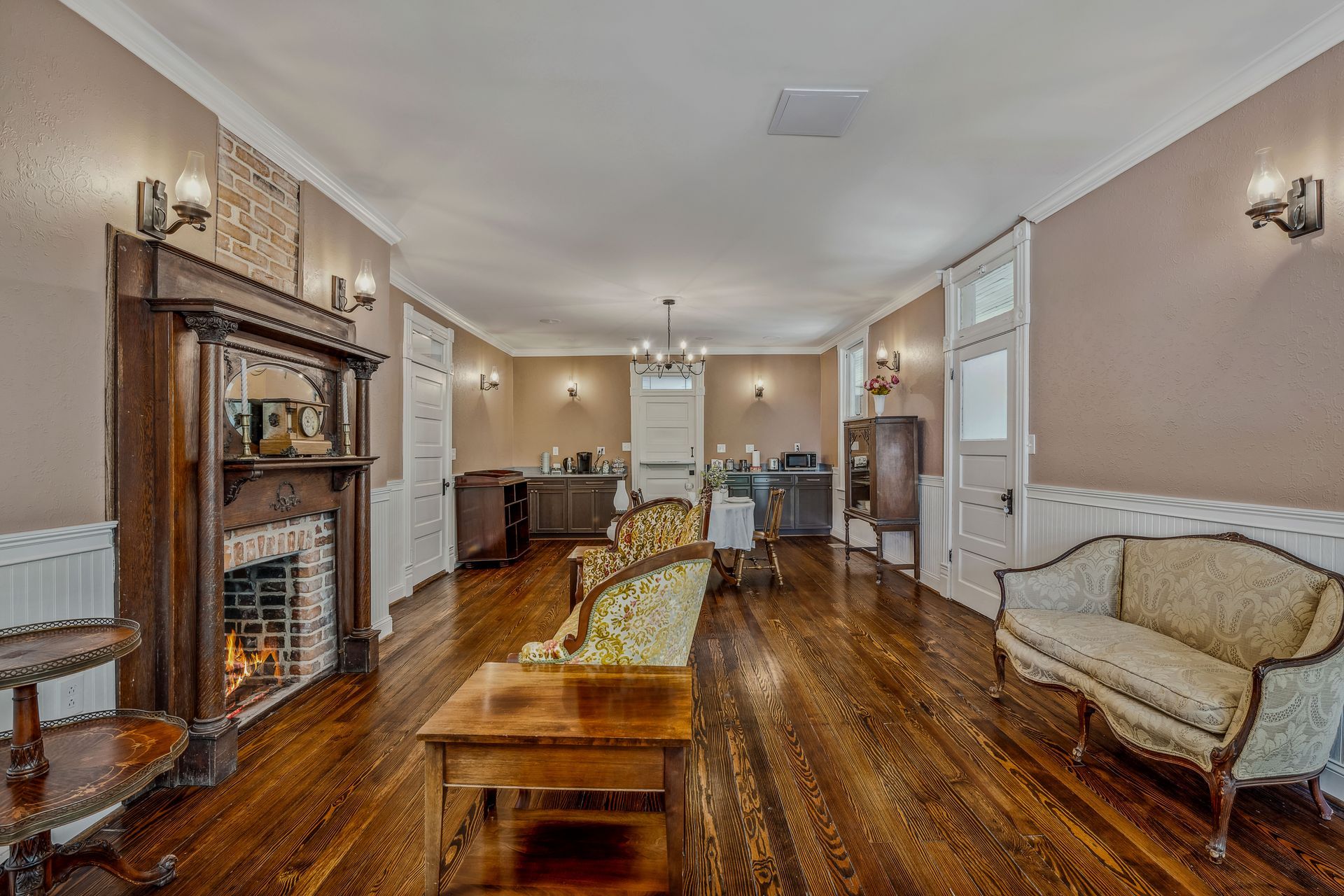 A living room filled with furniture and a fireplace.