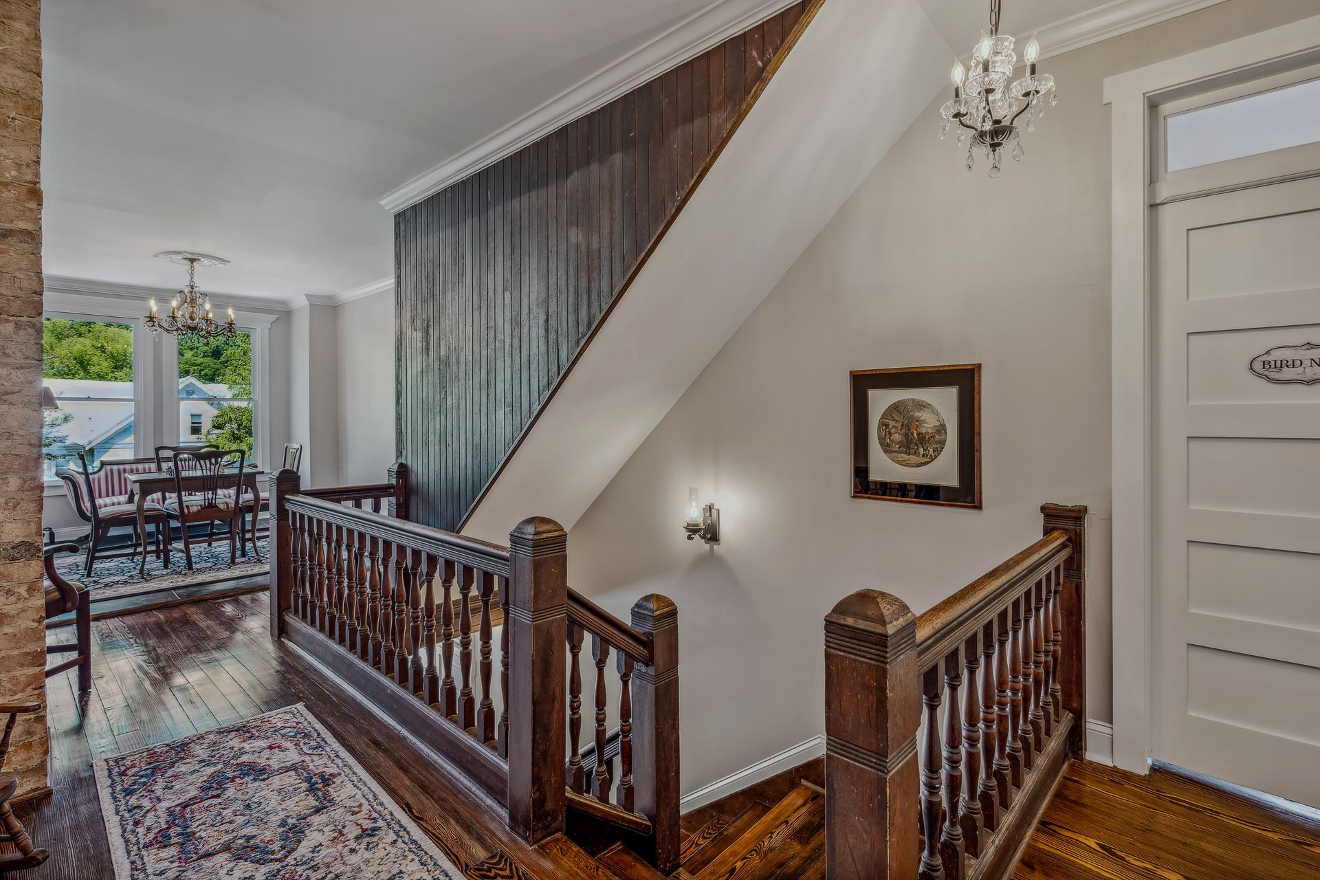 A wooden staircase leading up to the second floor of a house.