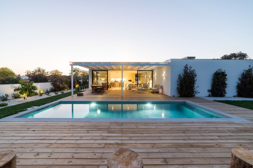 Swimming Pool in Front of a Modern White House With a Covered Patio — Brayden Stewart Building In Forster, NSW