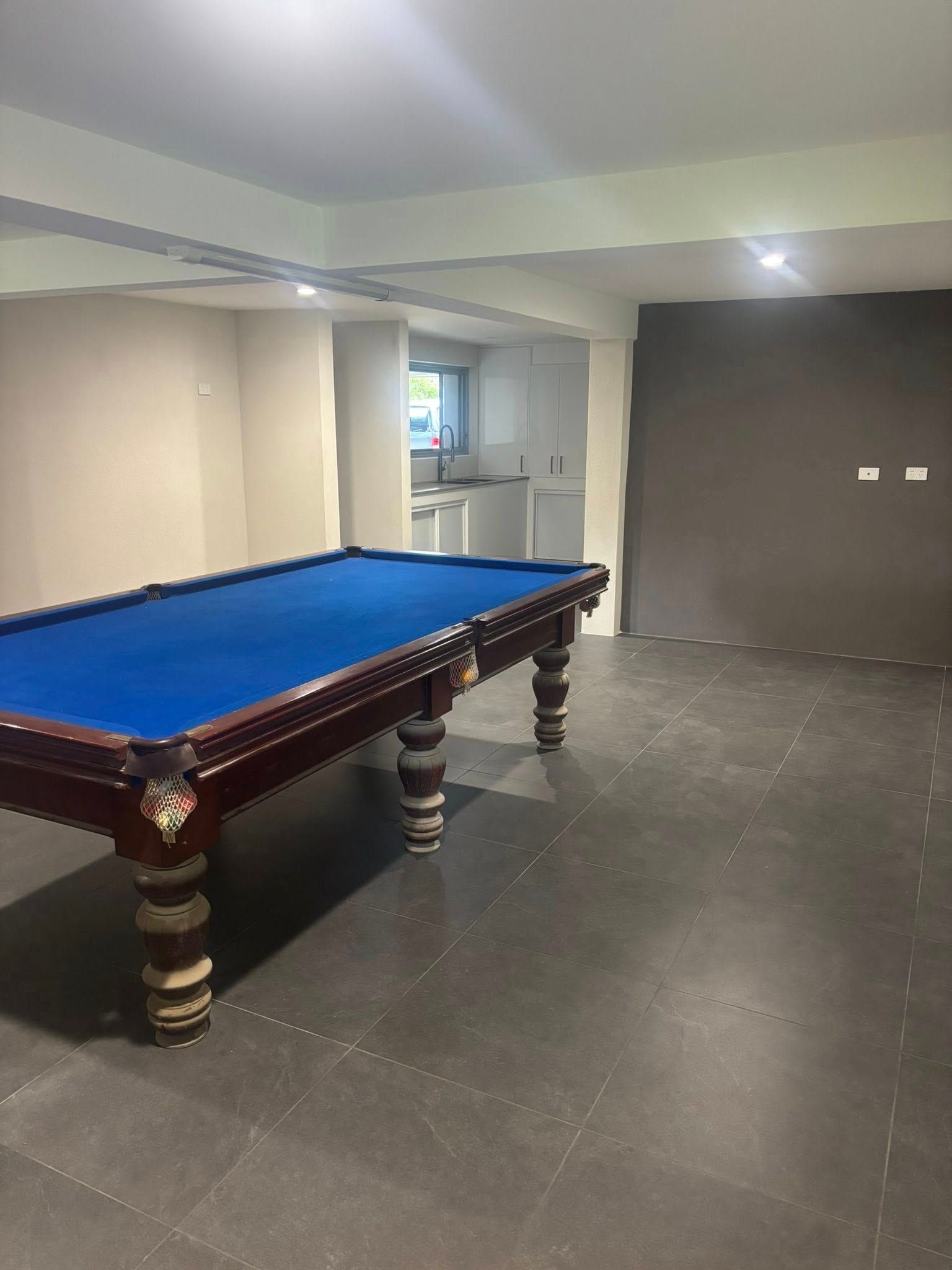 Pool Table in a Room With Dark Grey Flooring — Brayden Stewart Building In Tuncurry, NSW