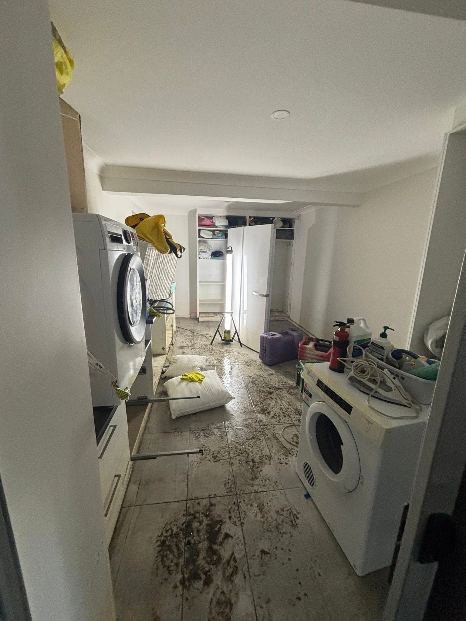 Laundry Room With Debris on Floor — Brayden Stewart Building In Tuncurry, NSW