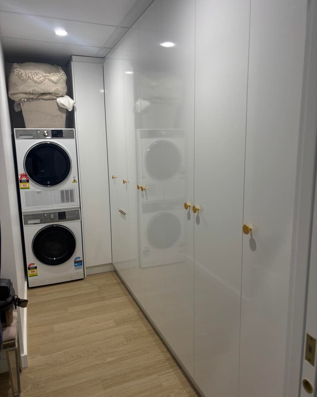 Laundry Room With Stacked Washer and Dryer — Brayden Stewart Building In Tuncurry, NSW