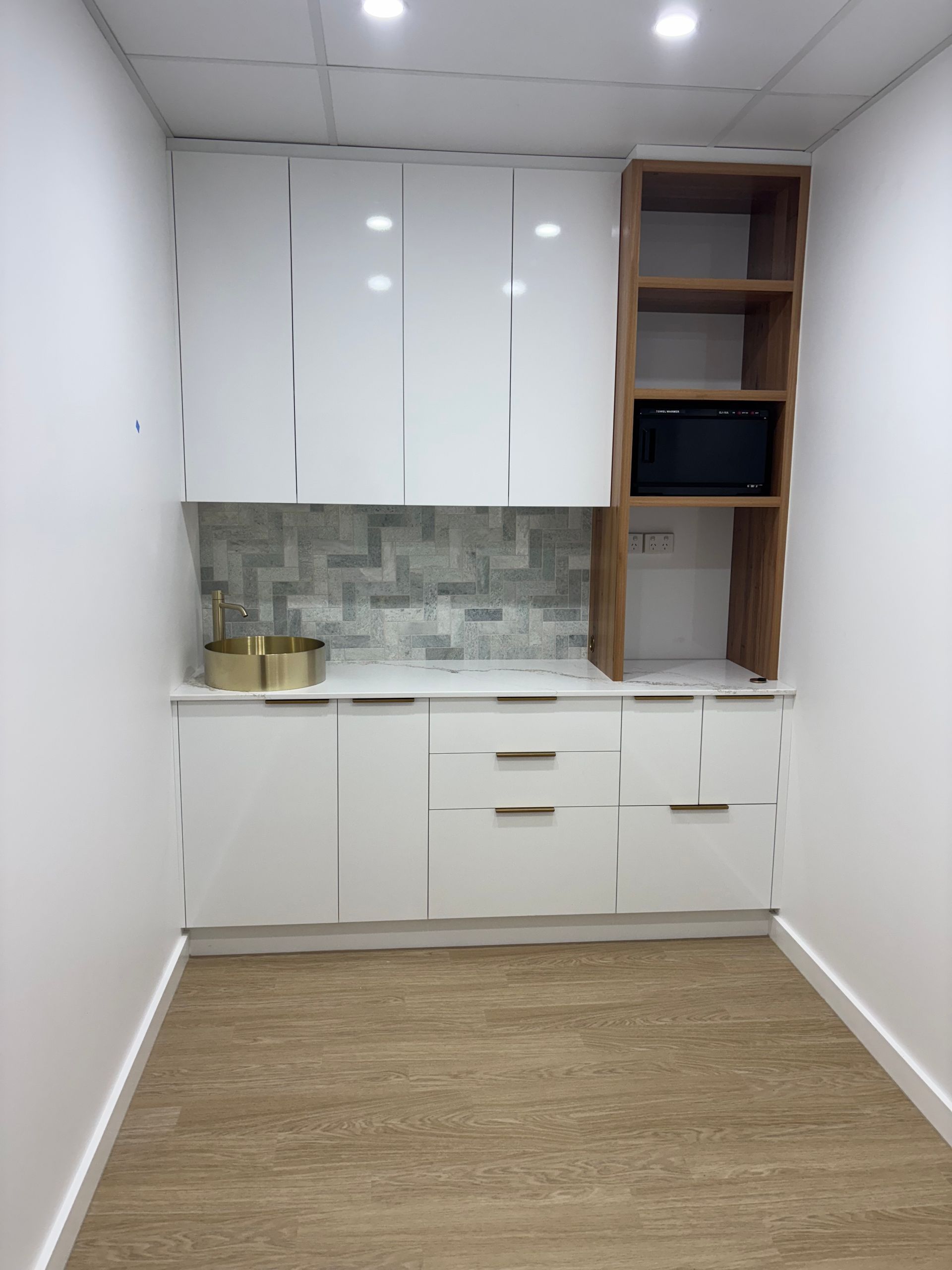 White and Wood-toned Cabinets With a Microwave — Brayden Stewart Building In Tuncurry, NSW